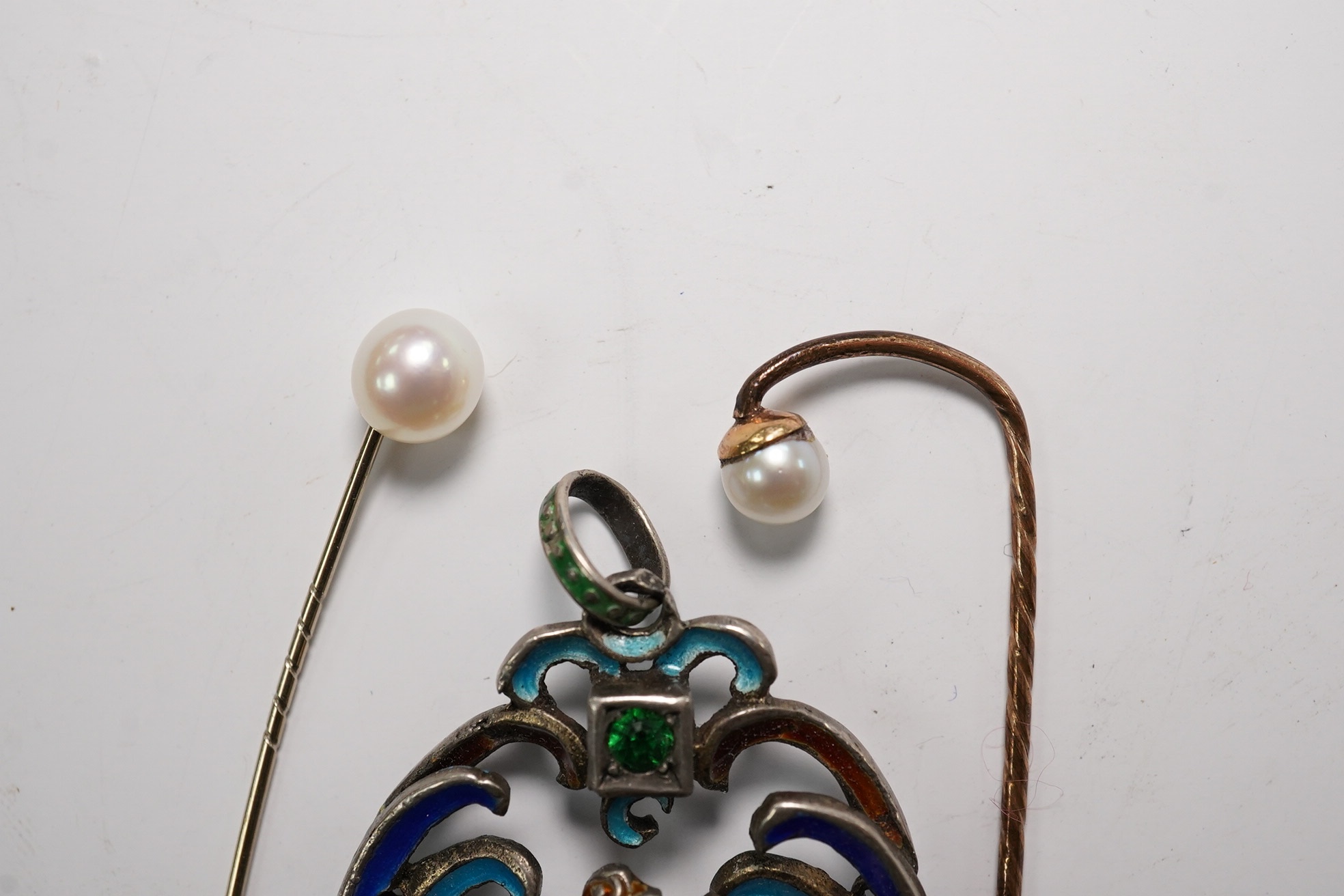 An Austro-Hungarian? white metal and polychrome enamel set St. George & the Dragon, drop pendant, 55mm and two stick pins. Condition - poor to fair